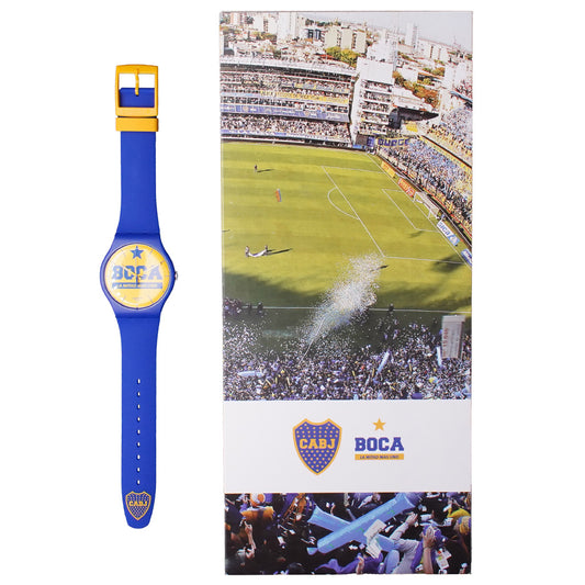 Produktfoto-1 der New Gent Armbanduhr LA MITAD MÁS UNO Set (BOCA) – SUOZ177: Blaue Uhr mit gelbem Zifferblatt neben Box mit Stadionmotiv.